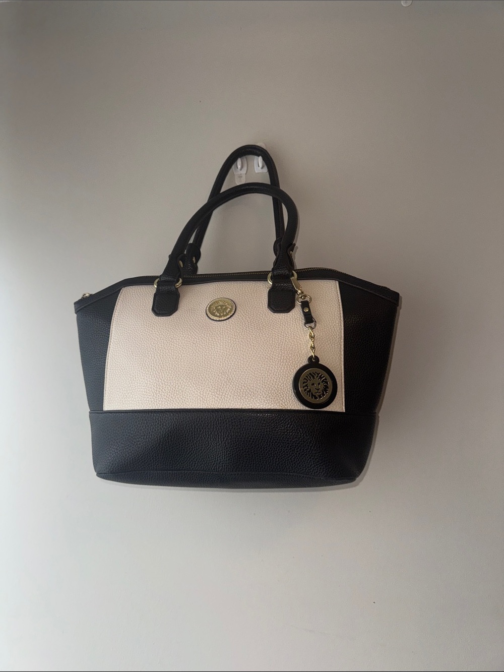 Anne Klein Black and Cream Tote with Charm Accent